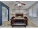Spacious main bedroom with ceiling fan, ensuite bath and large window at 2099 Port Royal Dr, Laughlin, NV 89029
