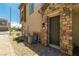 Stylish stone-accented entrance with modern utilities and desert landscaping at 216 Callen Falls Ave # 1423, Henderson, NV 89011