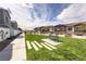 Green space with bench seating and concrete pavers between neighborhood residences at 216 Callen Falls Ave # 1423, Henderson, NV 89011