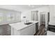 Kitchen with white cabinets, stainless appliances, and a center island at 216 Callen Falls Ave # 1423, Henderson, NV 89011