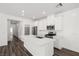 Bright, modern kitchen with white cabinets, stainless steel appliances and kitchen island at 216 Callen Falls Ave # 1423, Henderson, NV 89011