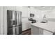 The modern kitchen features stainless steel appliances and a center island at 216 Callen Falls Ave # 1423, Henderson, NV 89011