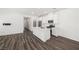 Open kitchen with white cabinets, stainless steel appliances, and an island at 216 Callen Falls Ave # 1423, Henderson, NV 89011