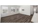 Open-concept living area with laminate flooring and bright natural light at 216 Callen Falls Ave # 1423, Henderson, NV 89011