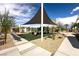 Community playground featuring shaded play structures, benches, and landscaped surroundings at 216 Callen Falls Ave # 1423, Henderson, NV 89011