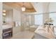 Bright bathroom with tub, walk-in shower, and vanity with bench and luxury finishes at 222 Karen Ave # 3208, Las Vegas, NV 89109