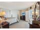 Bedroom featuring dark wood furnishings, TV, and bright lighting at 222 Karen Ave # 3208, Las Vegas, NV 89109