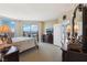 Bedroom with dark wood furnishings, TV, and sliding glass doors with a view at 222 Karen Ave # 3208, Las Vegas, NV 89109