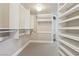 Spacious walk-in closet with multiple shelving and closet organizers at 222 Karen Ave # 3208, Las Vegas, NV 89109