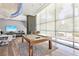 Bright game room with a modern pool table, lounge area and lots of windows for natural light at 222 Karen Ave # 3208, Las Vegas, NV 89109