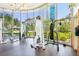Well-equipped gym with weight machines, a punching bag, and large windows overlooking green landscaping at 222 Karen Ave # 3208, Las Vegas, NV 89109