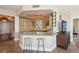 Stylish kitchen with granite countertops and barstool seating adjacent to living area at 222 Karen Ave # 3208, Las Vegas, NV 89109