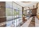 Refined lobby area with contemporary design, comfortable seating, and stunning views through expansive windows at 222 Karen Ave # 3208, Las Vegas, NV 89109