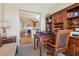 Open office space with an opening looking into the kitchen and a built-in bookcase with storage cabinets at 222 Karen Ave # 3208, Las Vegas, NV 89109