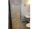 Bathroom with a shower featuring glass doors and a tile floor with a decorative rug at 225 Dogwood St, Henderson, NV 89015