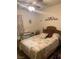 Bedroom with a quilt patterned bedspread, ceiling fan and decorative wall art at 225 Dogwood St, Henderson, NV 89015