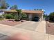 Charming single-story home with a carport and low-maintenance desert landscaping in front at 225 Dogwood St, Henderson, NV 89015