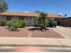 Single Gathering home with mature palm trees and carport over the driveway at 225 Dogwood St, Henderson, NV 89015