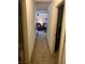 Hallway showcasing access to multiple rooms and leading into a living area with carpet flooring at 225 Dogwood St, Henderson, NV 89015