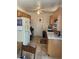 The functional kitchen features tile floors, countertops, and essential appliances, providing a practical cooking space at 225 Dogwood St, Henderson, NV 89015