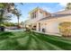 Spacious backyard featuring a well-maintained lawn, perfect for outdoor activities and entertaining at 2346 Villandry Ct, Henderson, NV 89074