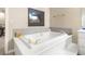 Bathroom showcasing a large soaking tub and fireplace, perfect for relaxation at 2346 Villandry Ct, Henderson, NV 89074