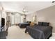 Bright bedroom with two beds, a TV, and large windows providing natural light at 2346 Villandry Ct, Henderson, NV 89074
