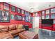 Bonus room decorated with film posters and a leather sofa set, ideal for entertainment at 2346 Villandry Ct, Henderson, NV 89074