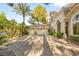 Spacious three-car garage with lush landscaping and ample driveway space for parking at 2346 Villandry Ct, Henderson, NV 89074