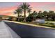 Scenic gated entrance to The Fountains community at sunset, showcasing lush landscaping and secure entry at 2346 Villandry Ct, Henderson, NV 89074