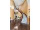 Grand foyer featuring a curved staircase, hardwood floors, and elegant chandelier at 2346 Villandry Ct, Henderson, NV 89074