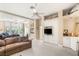Inviting living room boasts a built-in cabinet, and large windows for natural light at 2346 Villandry Ct, Henderson, NV 89074