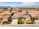 Expansive aerial view showcasing the home, its well-manicured landscaping, and the surrounding residential neighborhood at 2373 Ozark Plateau Dr, Henderson, NV 89044