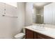 This half bath includes a vanity with storage and a modern toilet and shower at 2373 Ozark Plateau Dr, Henderson, NV 89044