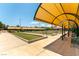 Bocce ball courts with multiple lanes and shaded seating, set in a beautifully landscaped community area at 2373 Ozark Plateau Dr, Henderson, NV 89044