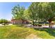 Community building with covered entrance framed by trees and landscaping, offering a welcoming gathering space at 2373 Ozark Plateau Dr, Henderson, NV 89044