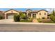 Charming single-story home featuring desert landscaping, a brick walkway, and an attached two-car garage at 2373 Ozark Plateau Dr, Henderson, NV 89044
