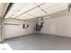 Spacious garage with epoxy floor, utility connections, and an automatic door at 2373 Ozark Plateau Dr, Henderson, NV 89044