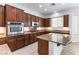 This beautiful kitchen features granite counters, stainless steel appliances, and lots of cabinet space at 2373 Ozark Plateau Dr, Henderson, NV 89044