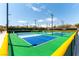 Community pickleball courts showing multiple playing surfaces, surrounded by green fencing and well-maintained landscaping at 2373 Ozark Plateau Dr, Henderson, NV 89044