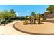 Community playground featuring yellow slides and climbing structures, surrounded by a safe, cushioned surface and landscaping at 2373 Ozark Plateau Dr, Henderson, NV 89044