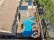 Aerial view of backyard with pool, rock waterfall feature, covered patio, and desert landscaping at 2409 Alpine Meadows Ave, Henderson, NV 89074