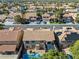 Expansive aerial view of a residential neighborhood featuring beautiful homes with tile roofs and lush landscaping at 2409 Alpine Meadows Ave, Henderson, NV 89074