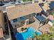 Aerial view showcases an outdoor living space complete with a pool, spa, and covered patio at 2409 Alpine Meadows Ave, Henderson, NV 89074