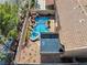 Aerial view showcases the private backyard with its sparkling pool, spa, and rock waterfall at 2409 Alpine Meadows Ave, Henderson, NV 89074