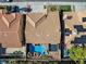 Overhead view showcases a private backyard pool with rock features, spa, and patio with a tile roof at 2409 Alpine Meadows Ave, Henderson, NV 89074