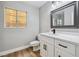 Updated bathroom featuring a modern vanity with a white countertop and a sleek faucet at 2409 Alpine Meadows Ave, Henderson, NV 89074