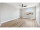 This bedroom features gray walls, wood floors, and a modern ceiling fan at 2409 Alpine Meadows Ave, Henderson, NV 89074