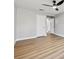 This bedroom features gray walls, wood floors, a closet and access to the bathroom at 2409 Alpine Meadows Ave, Henderson, NV 89074