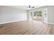 Large living room with a ceiling fan and large windows at 2409 Alpine Meadows Ave, Henderson, NV 89074